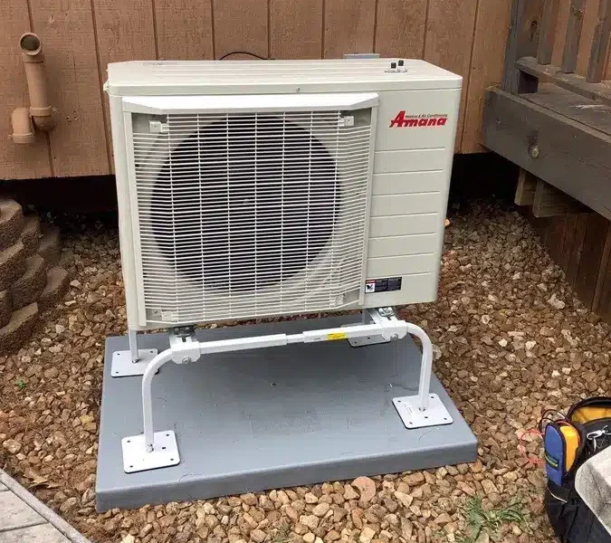 Heat pump outside of residential home in Ann Arbor, MI.