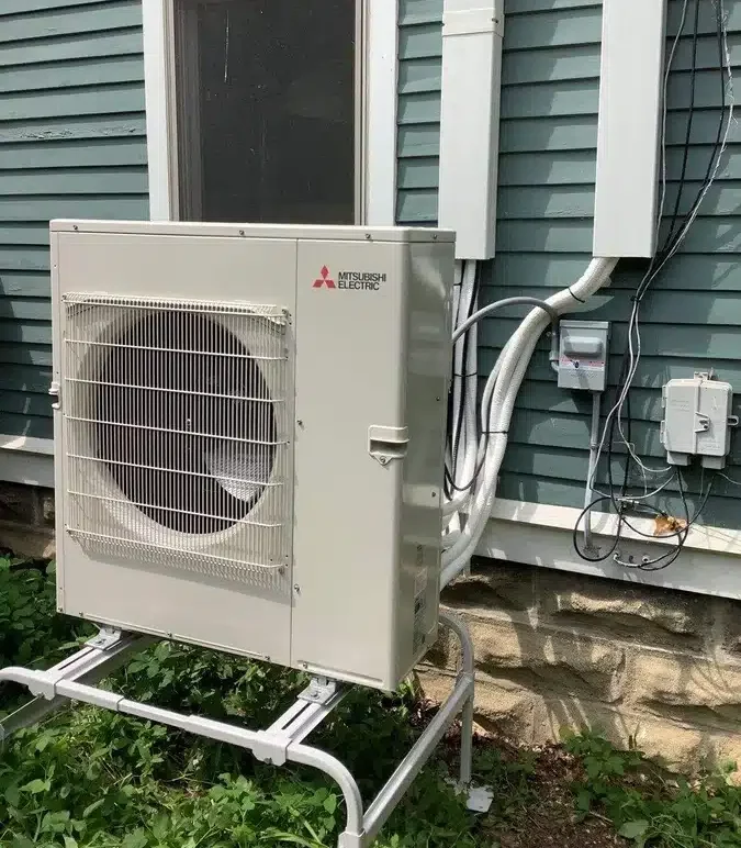 Heat pump outside of residential home in Ann Arbor, MI.