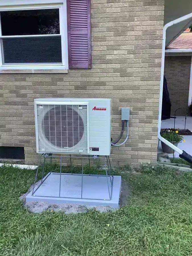 Heat pump outside of residential home in Ann Arbor, MI.