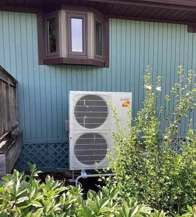 Heat pump outside of residential home in Ann Arbor, MI.