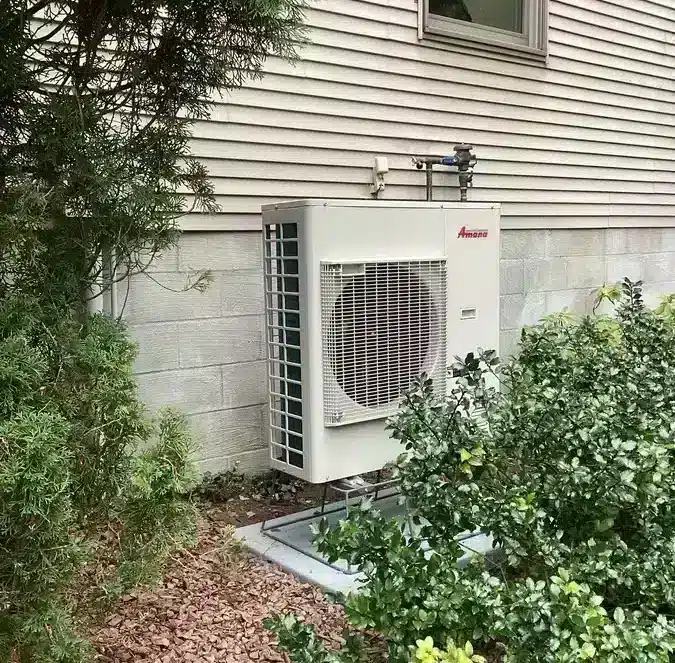 Heat pump outside of residential home in Ann Arbor, MI.