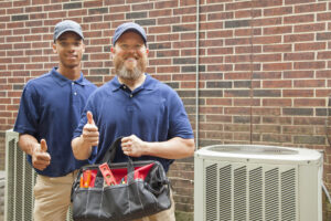 Air conditioner repairmen work on home unit Tool bag