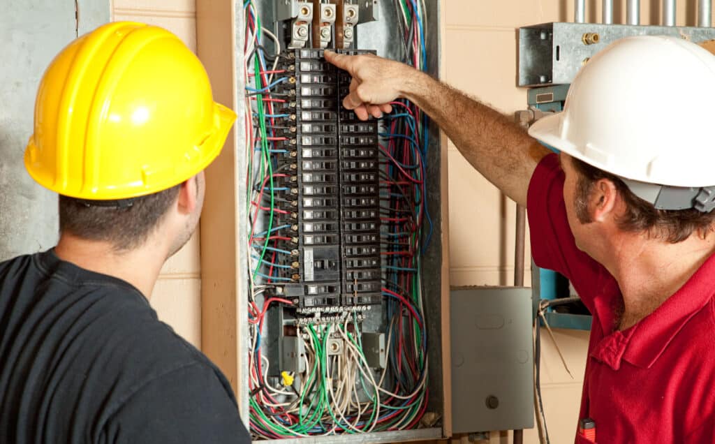 Techs working on electrical panel.