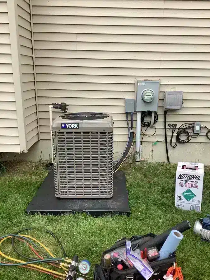 Air conditioner unit outside of residential home in Ann Arbor, MI.